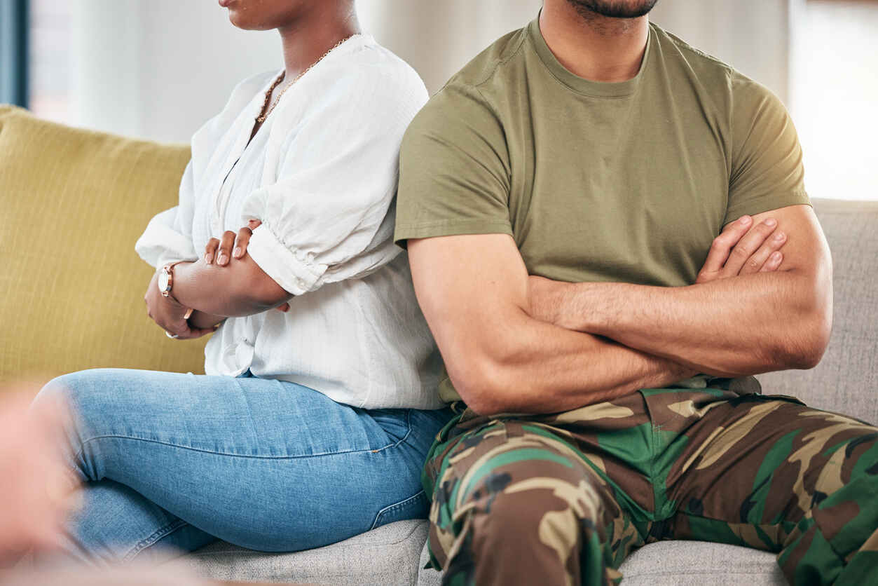 Military couple sitting apart during divorce consultation