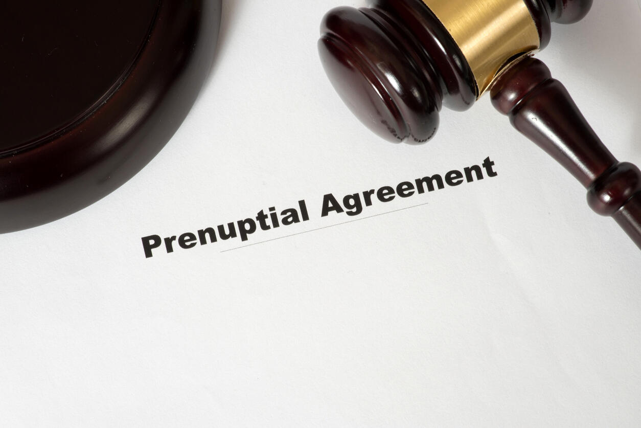 Prenuptial agreement document with gavel on desk.
